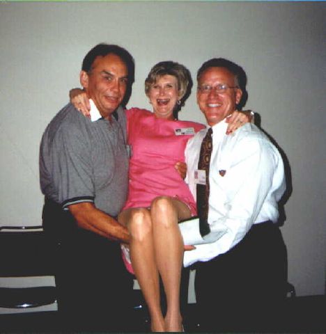 Jane Minor McCoy getting a little carried away with help from Danny Cheshawalla and Ray Buckner